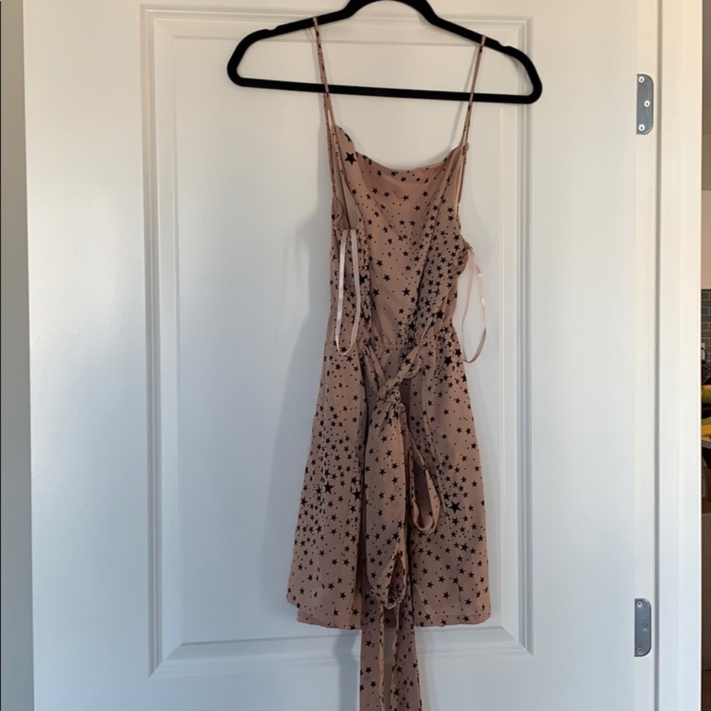 Super Down pink and black starred wrap tie dress